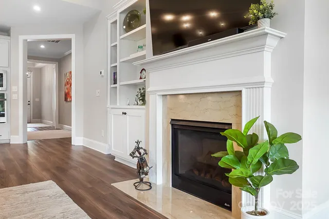 a vase of flowers sitting on a table in front of a house