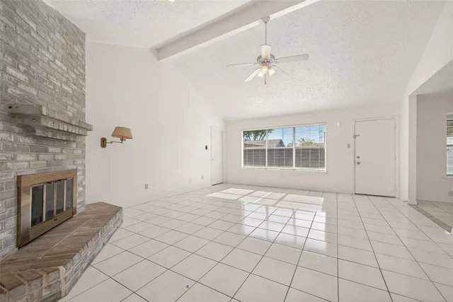 a view of an empty room with glass door