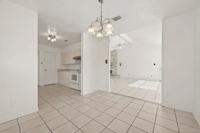 a view of a kitchen with a dishwasher and a refrigerator