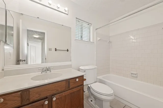 a bathroom with a sink a toilet and a bathtub