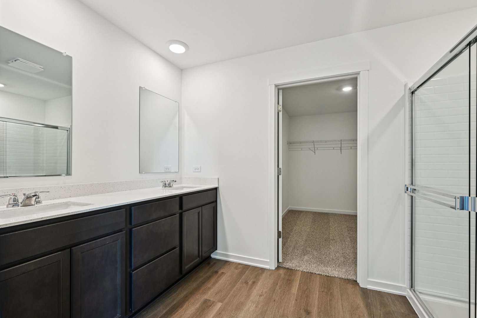 6722 Applegate Drive Plainfield, IL 60586 - Photo 29 of 45 a bathroom with a double vanity sink and mirror
