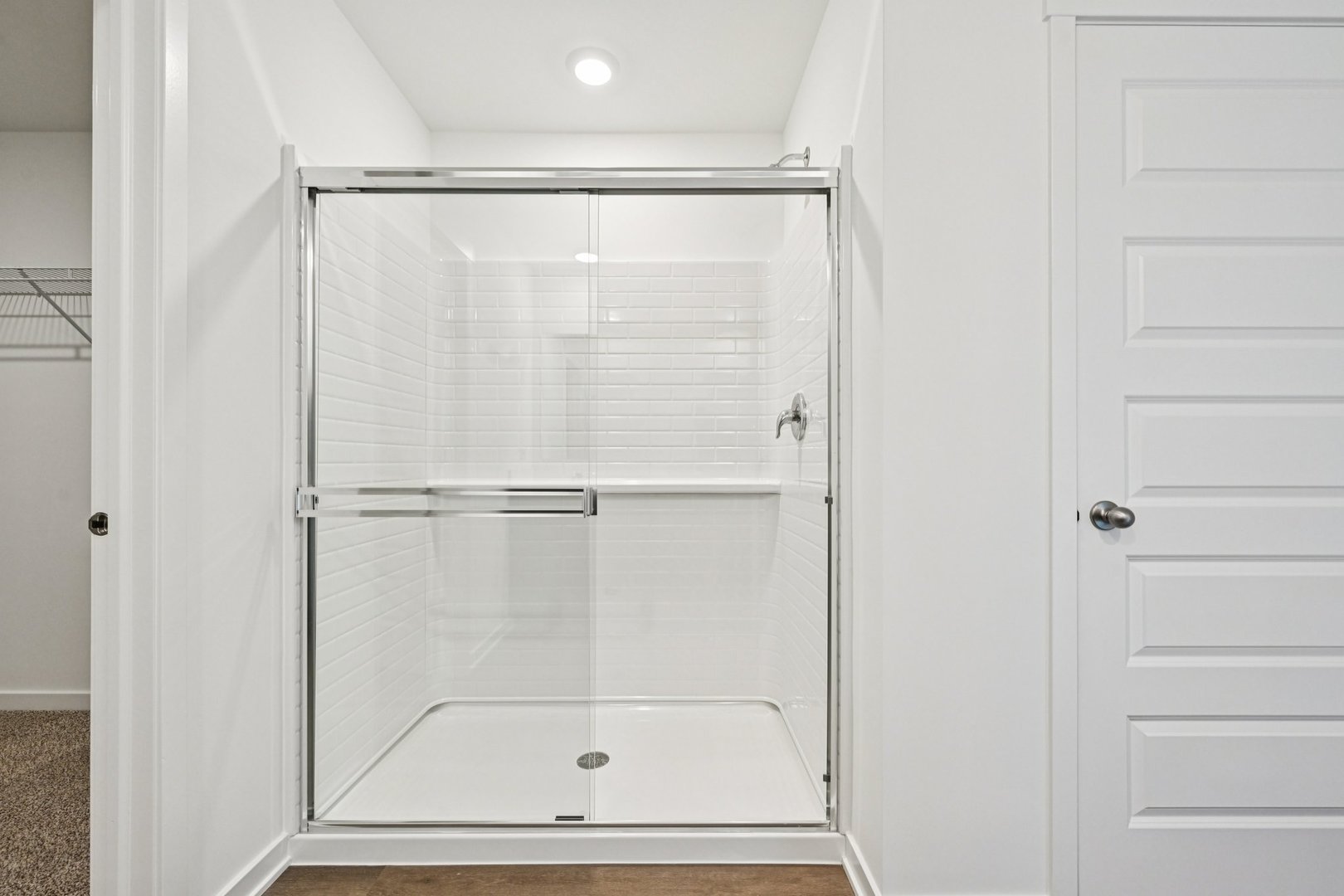 6722 Applegate Drive Plainfield, IL 60586 - Photo 30 of 45 a bathroom with a glass shower door