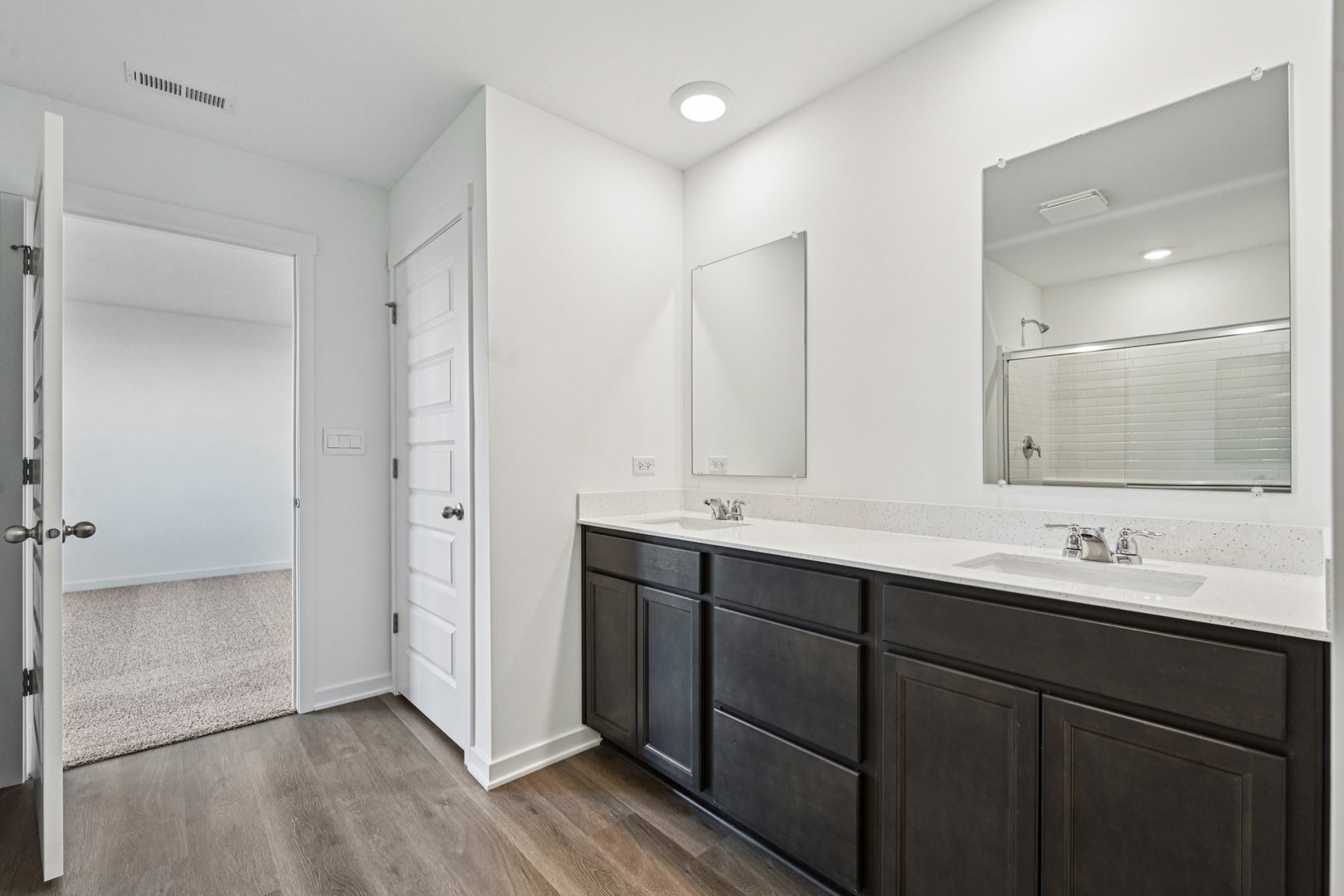 6722 Applegate Drive Plainfield, IL 60586 - Photo 32 of 45 a bathroom with double sink and mirror