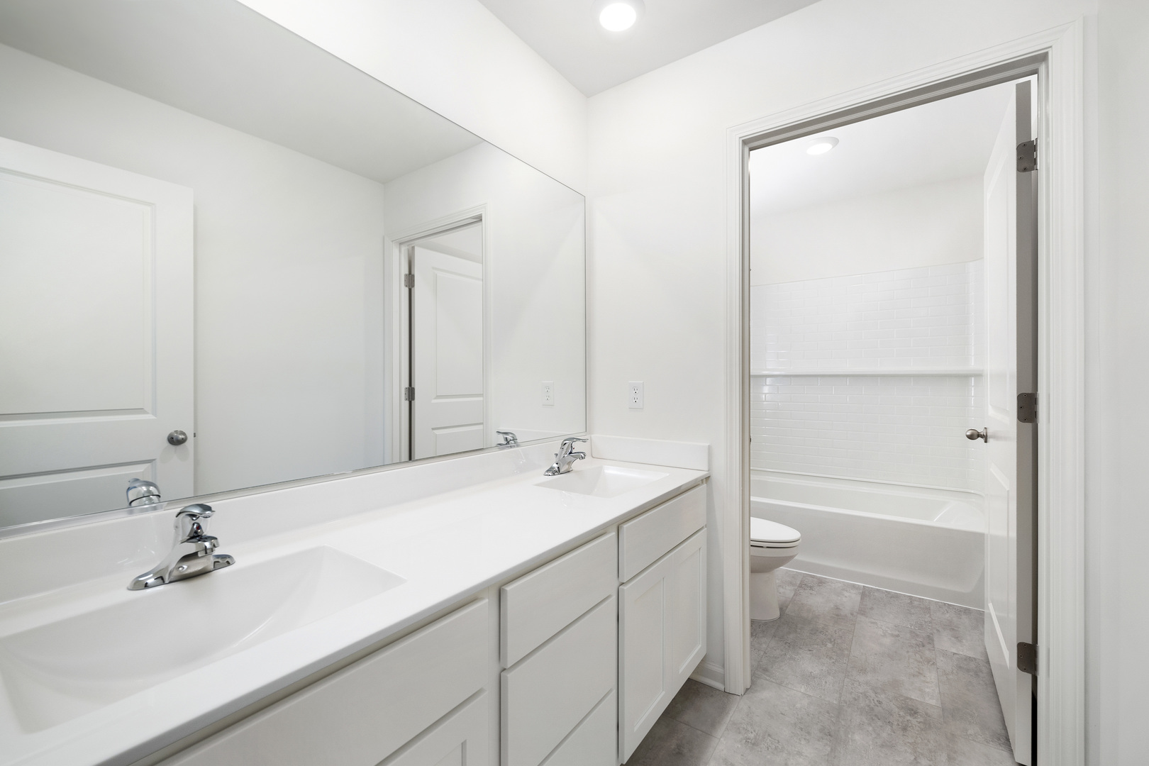 6722 Applegate Drive Plainfield, IL 60586 - Photo 44 of 45 a bathroom with a sink a toilet and a mirror