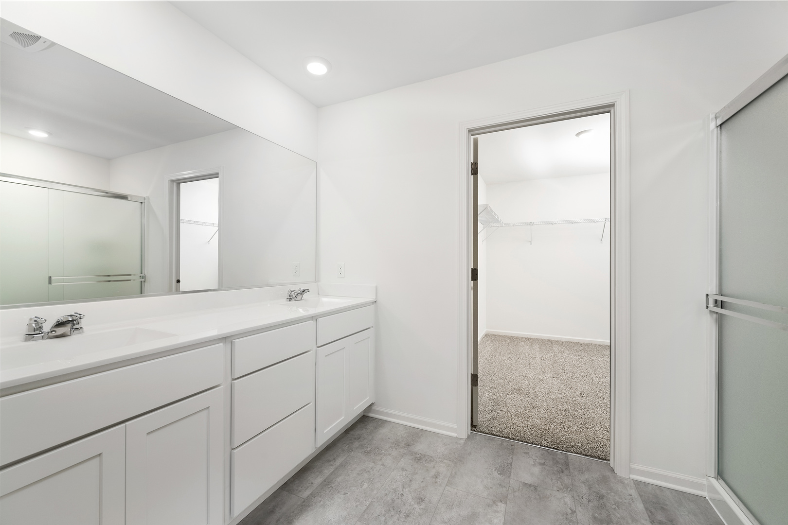 6722 Applegate Drive Plainfield, IL 60586 - Photo 45 of 45 a bathroom with a double vanity sink and a mirror