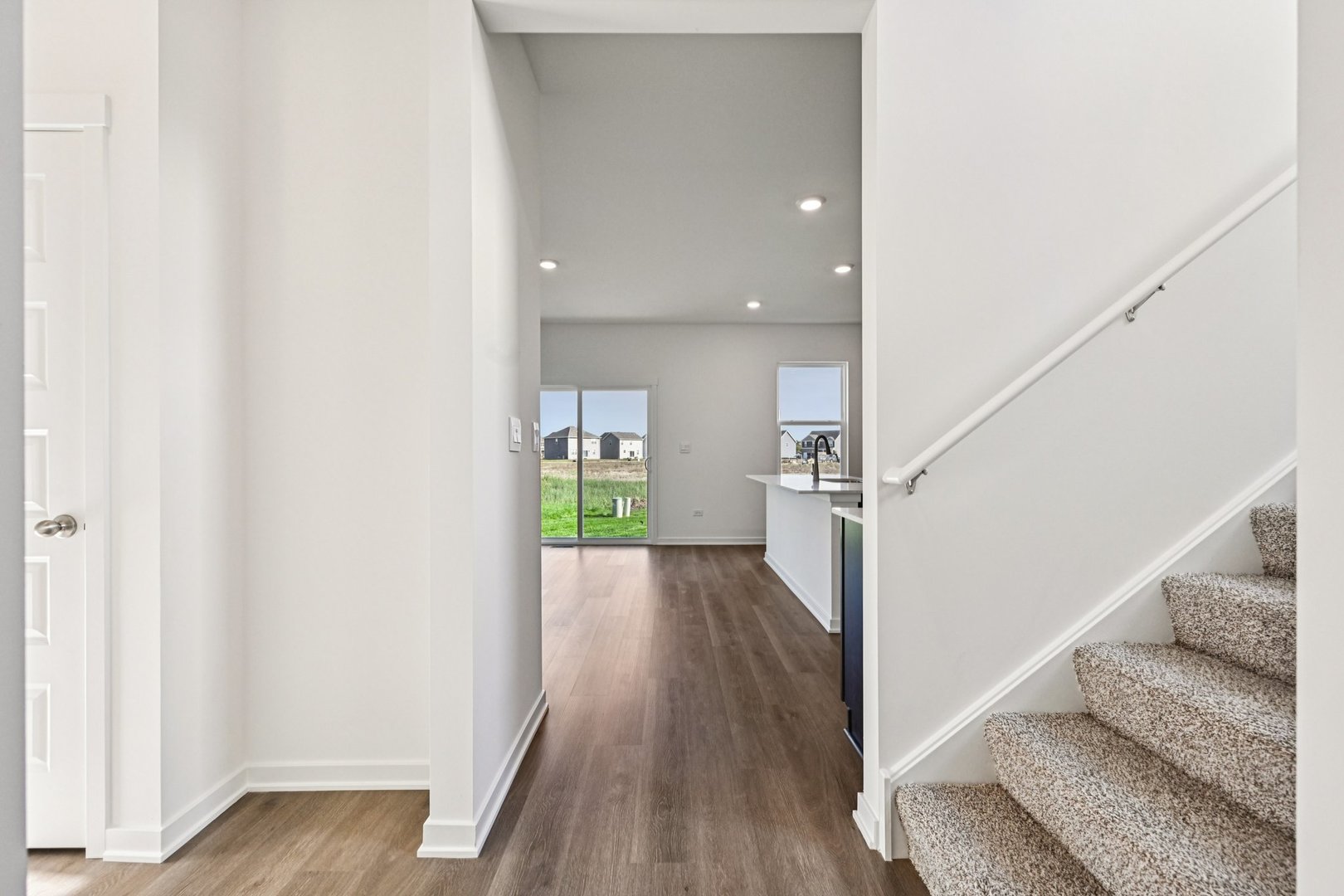 6722 Applegate Drive Plainfield, IL 60586 - Photo 6 of 45 a view of entryway and hall with wooden floor