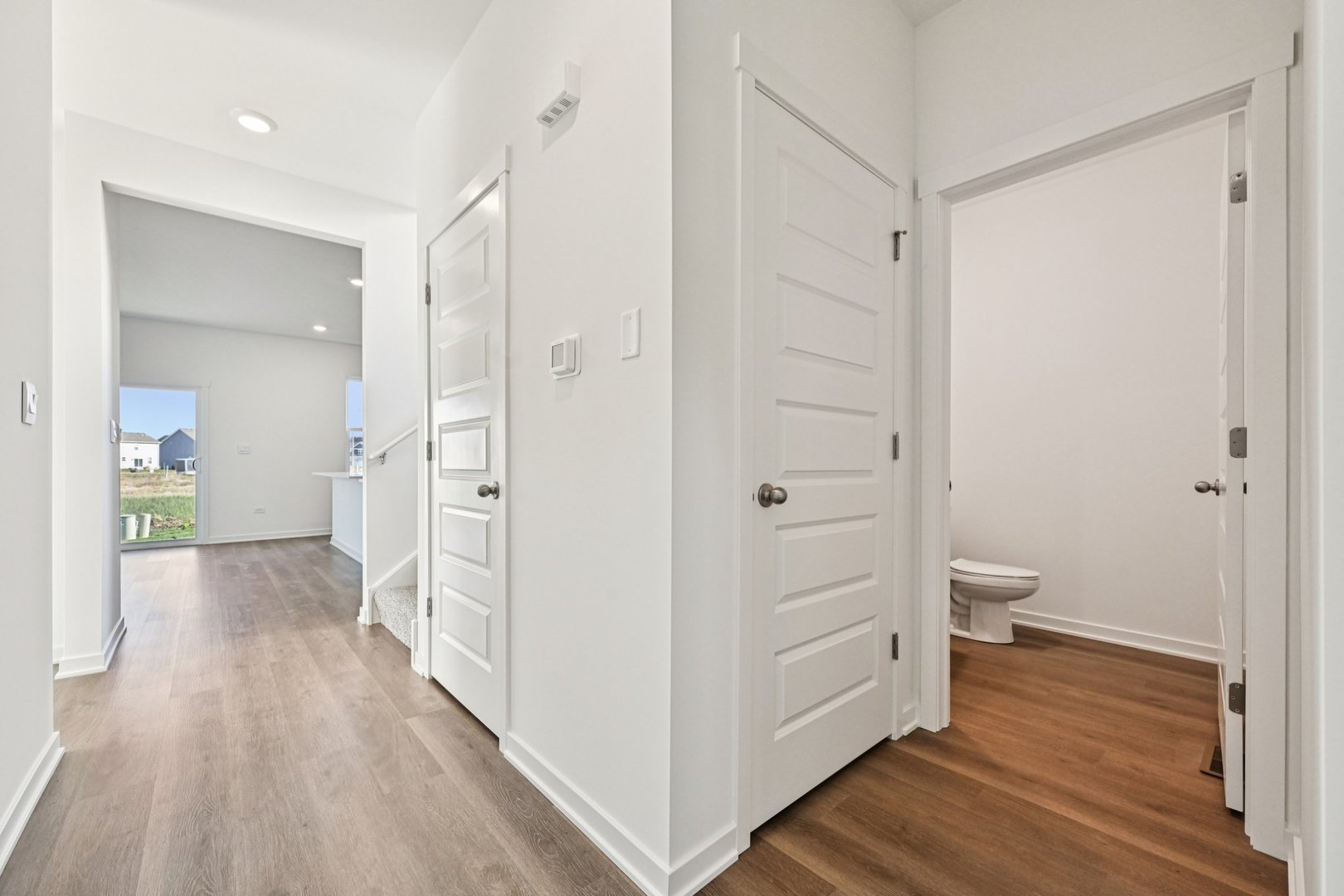 6722 Applegate Drive Plainfield, IL 60586 - Photo 7 of 45 a view of a bathroom from a hallway
