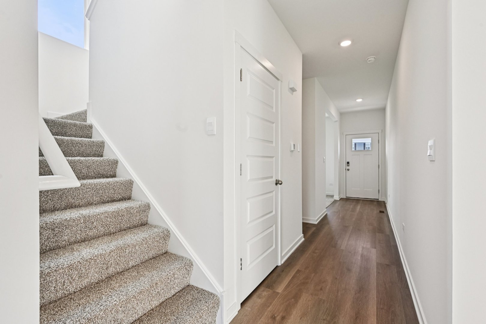 6722 Applegate Drive Plainfield, IL 60586 - Photo 9 of 45 a view of a hallway with wooden floor and entryway