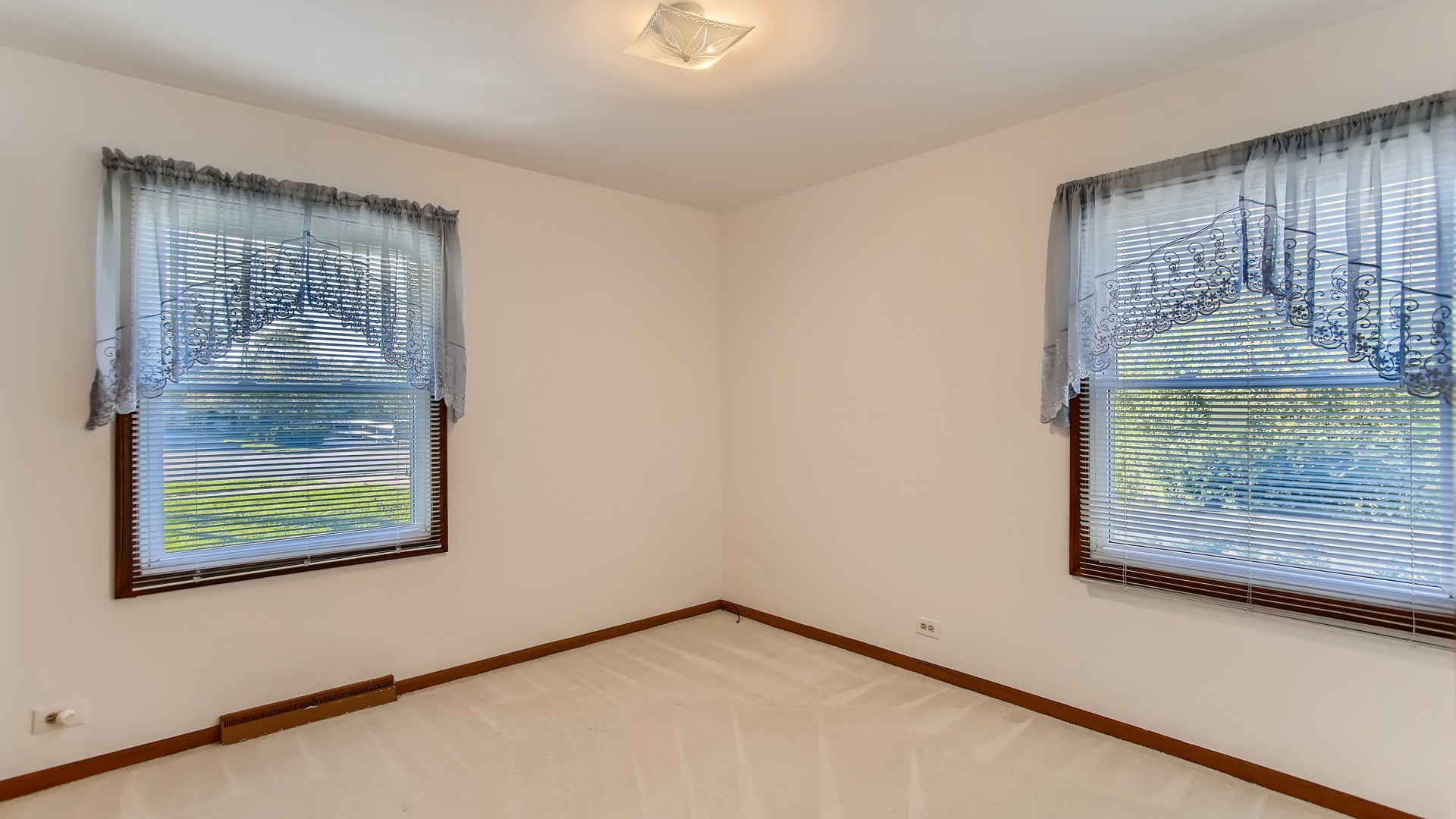 171 Raupp Boulevard Buffalo Grove, IL 60089 - Photo 14 of 23 a view of an empty room with wooden floor and a window