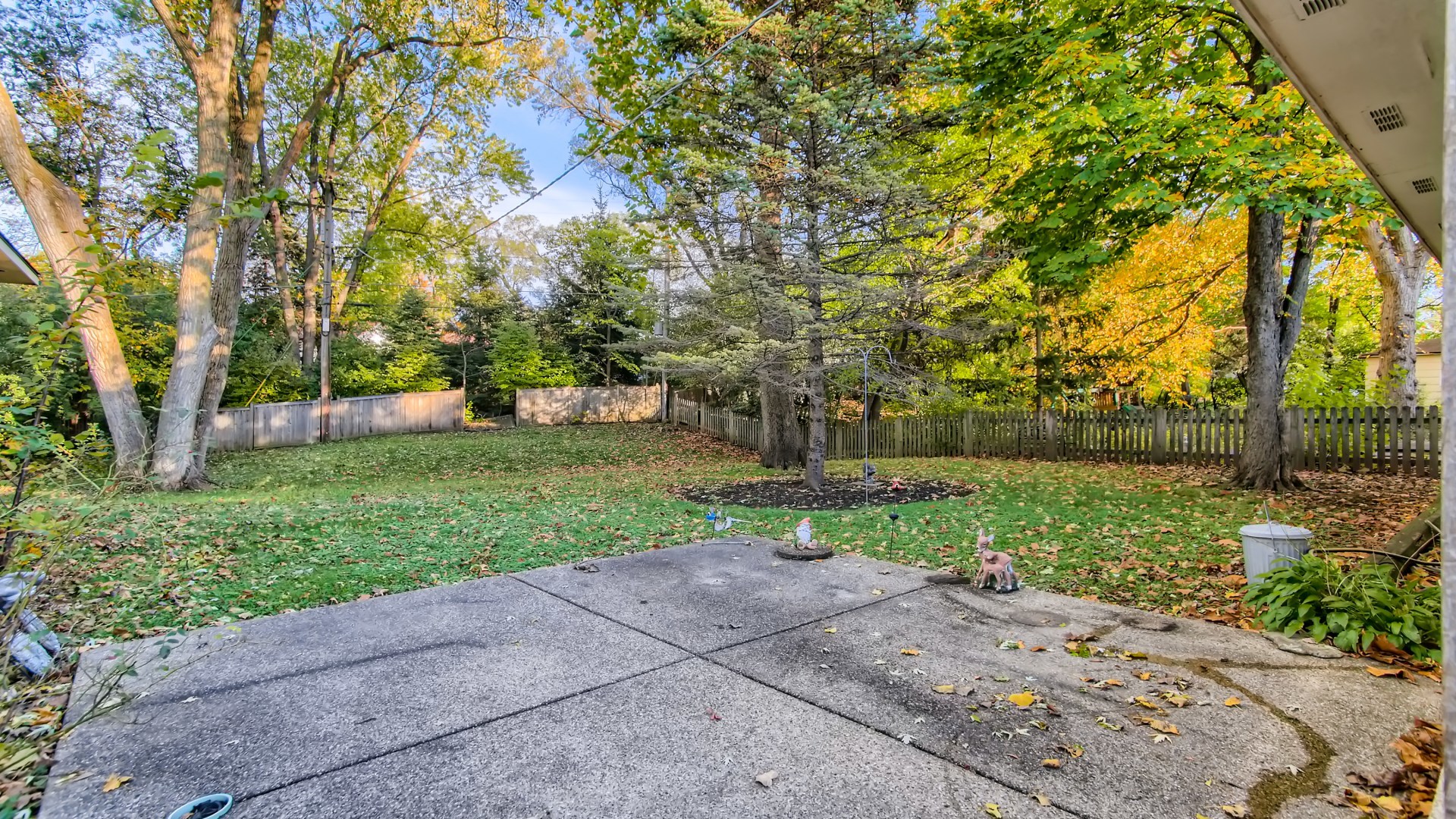 171 Raupp Boulevard Buffalo Grove, IL 60089 - Photo 21 of 23 a view of a backyard with large trees