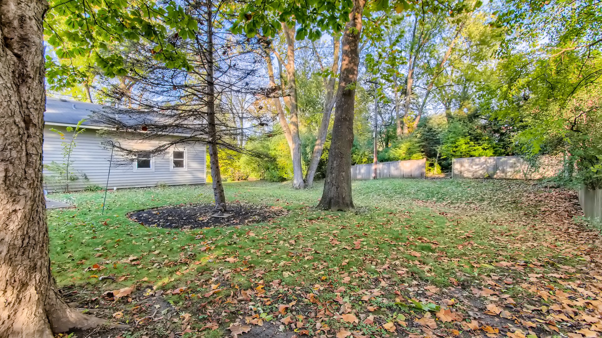171 Raupp Boulevard Buffalo Grove, IL 60089 - Photo 22 of 23 a backyard of a house with lots of green space