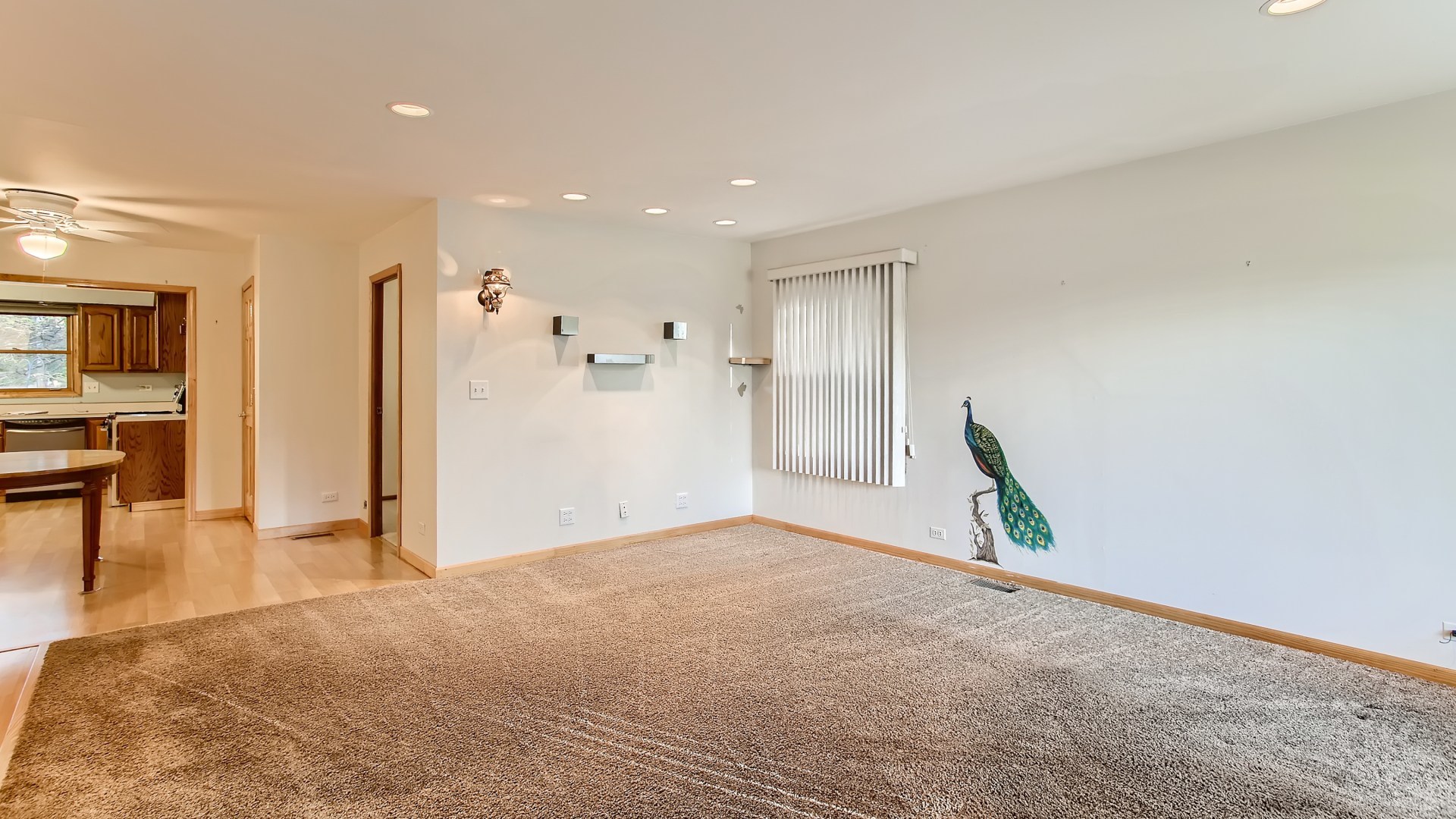 171 Raupp Boulevard Buffalo Grove, IL 60089 - Photo 5 of 23 a view of livingroom with hardwood floor and a ceiling fan