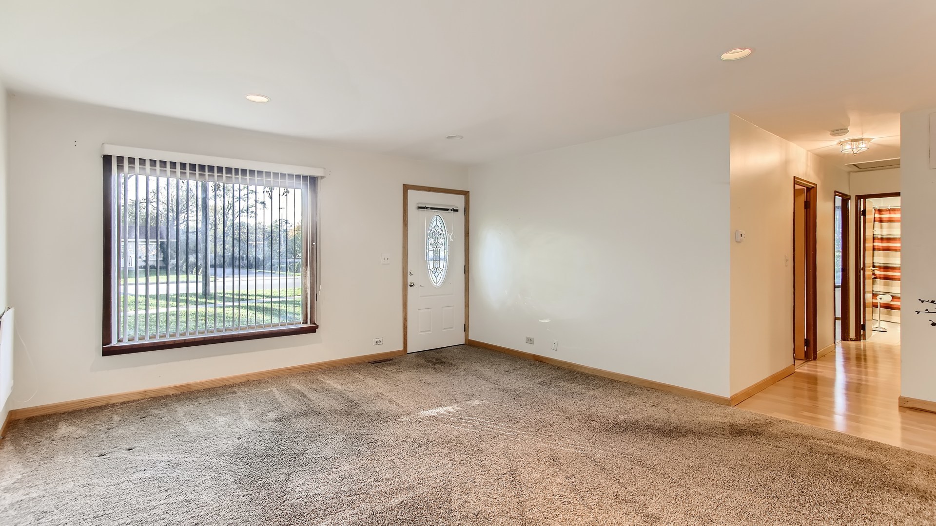 171 Raupp Boulevard Buffalo Grove, IL 60089 - Photo 6 of 23 a view of an empty room with glass door