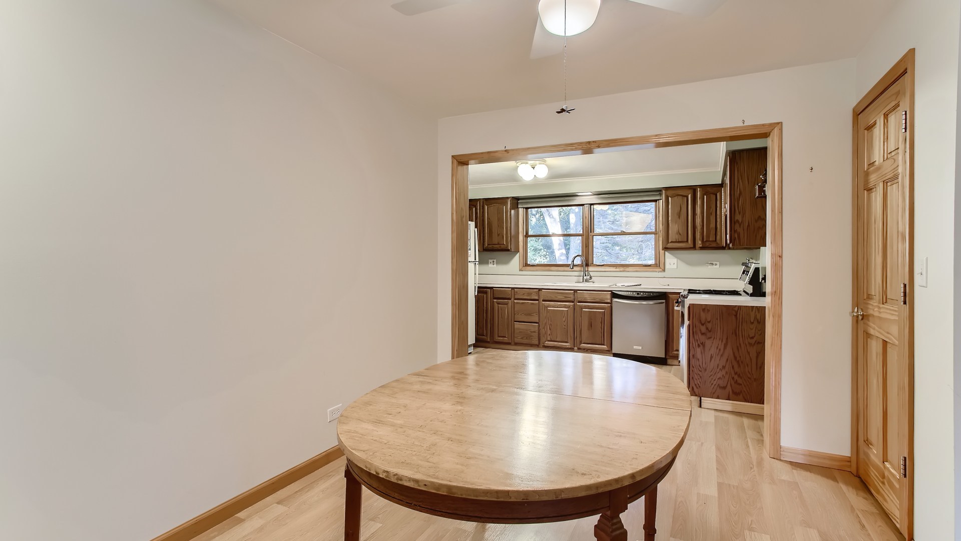 171 Raupp Boulevard Buffalo Grove, IL 60089 - Photo 7 of 23 a kitchen with kitchen island a sink appliances and cabinets