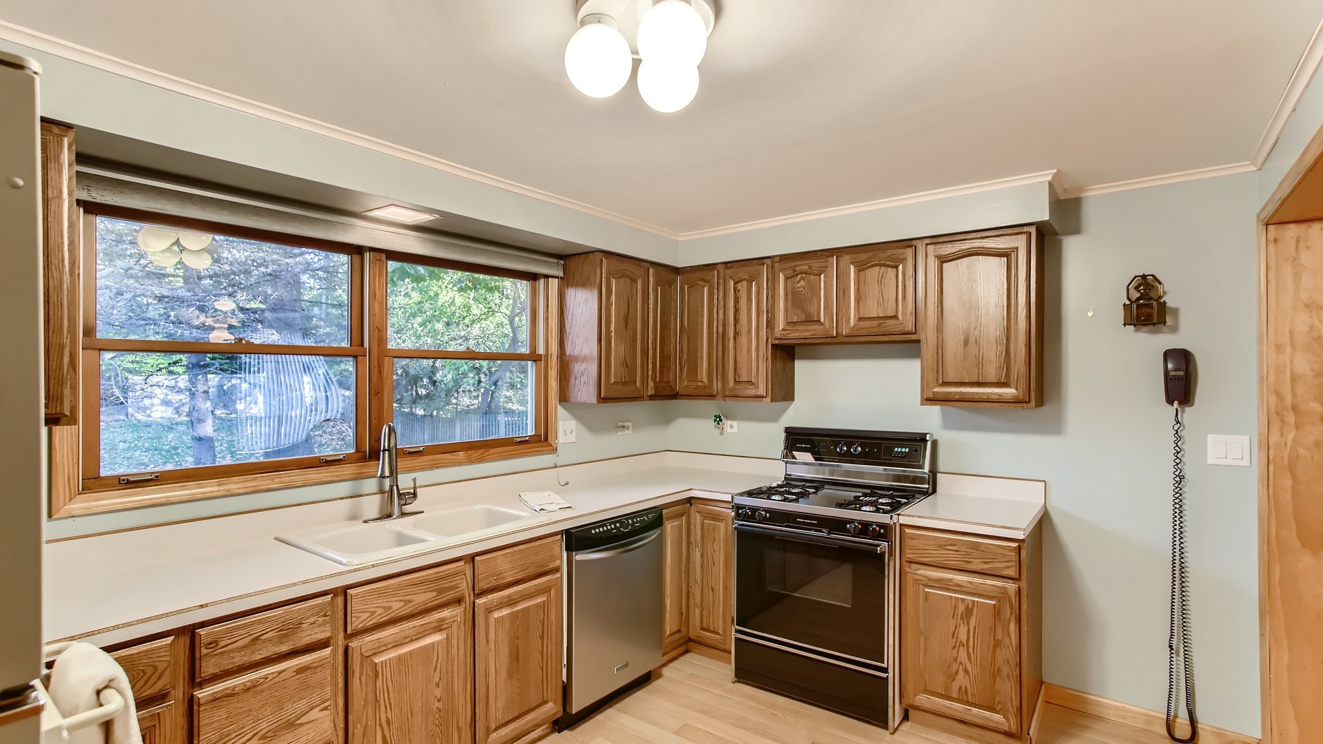 171 Raupp Boulevard Buffalo Grove, IL 60089 - Photo 9 of 23 a kitchen with stainless steel appliances a stove sink and cabinets