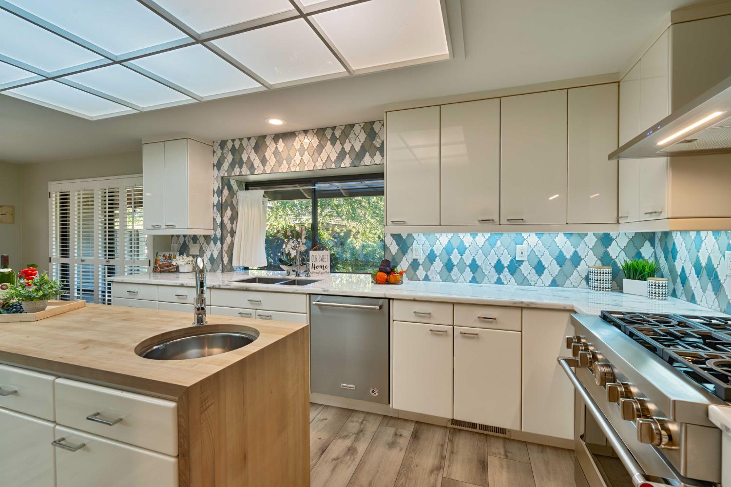 7529 Pineridge Road Fair Oaks, CA 95628 - Photo 11 of 62 a kitchen with granite countertop a sink stainless steel appliances and cabinets