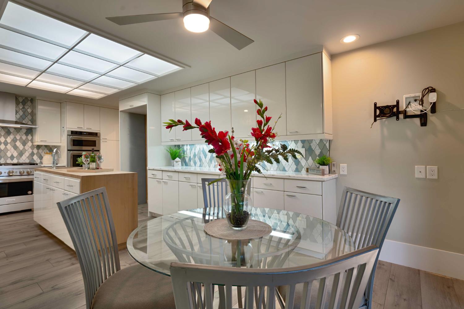 7529 Pineridge Road Fair Oaks, CA 95628 - Photo 13 of 62 a view of a dining room with furniture window and wooden floor
