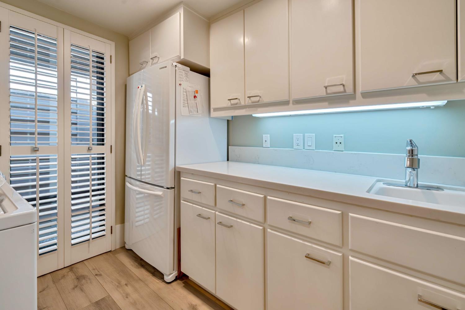 7529 Pineridge Road Fair Oaks, CA 95628 - Photo 38 of 62 a kitchen with stainless steel appliances white cabinets and a refrigerator
