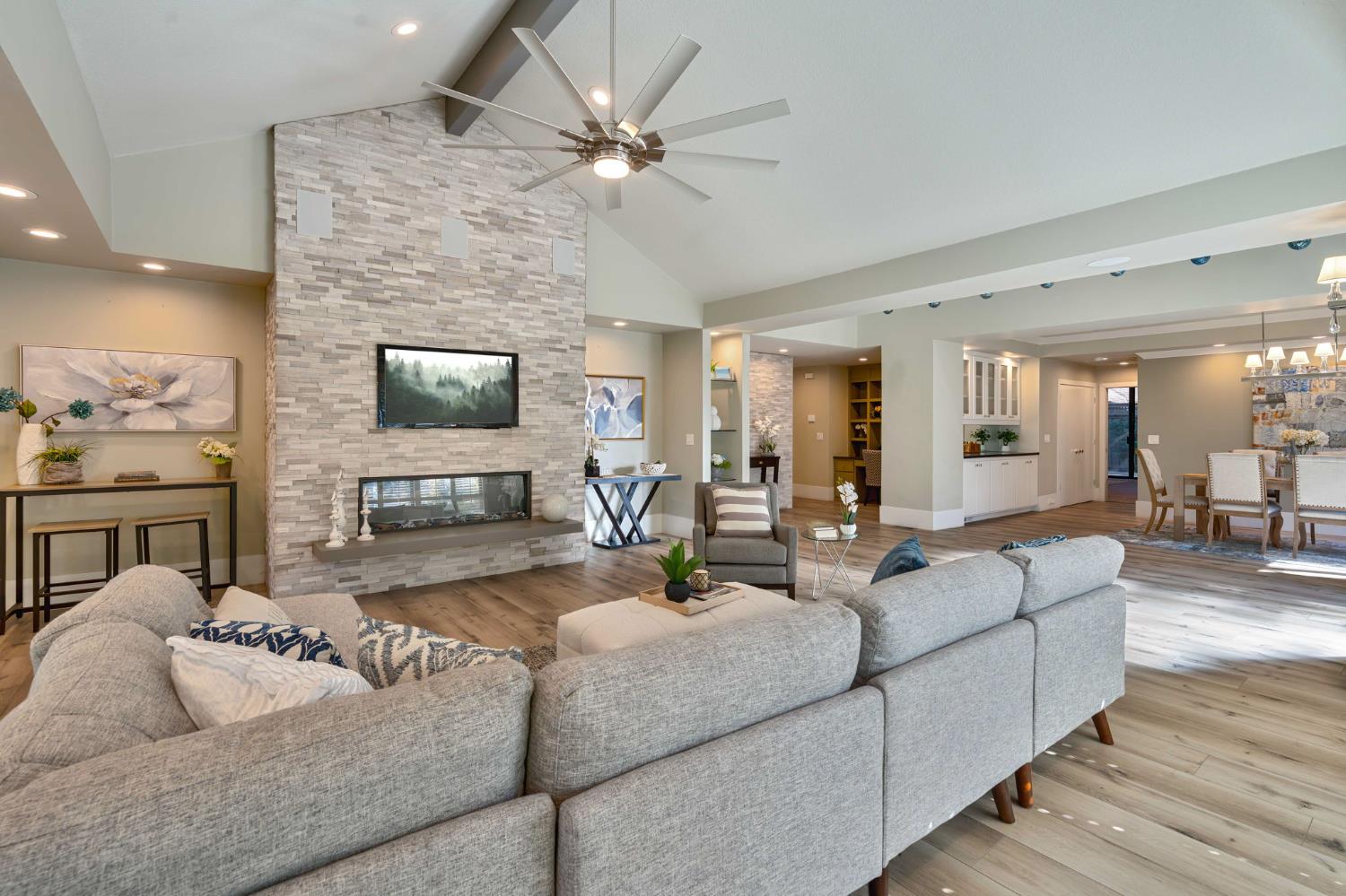 7529 Pineridge Road Fair Oaks, CA 95628 - Photo 6 of 62 a living room with furniture a fireplace and a flat screen tv