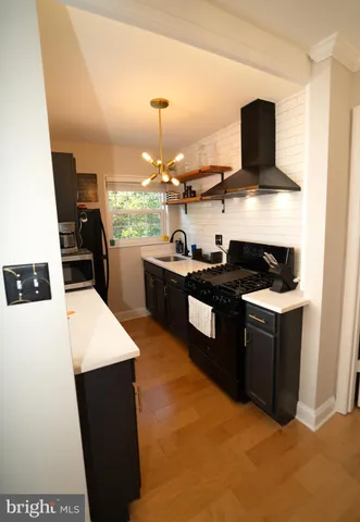a kitchen with a stove and a refrigerator