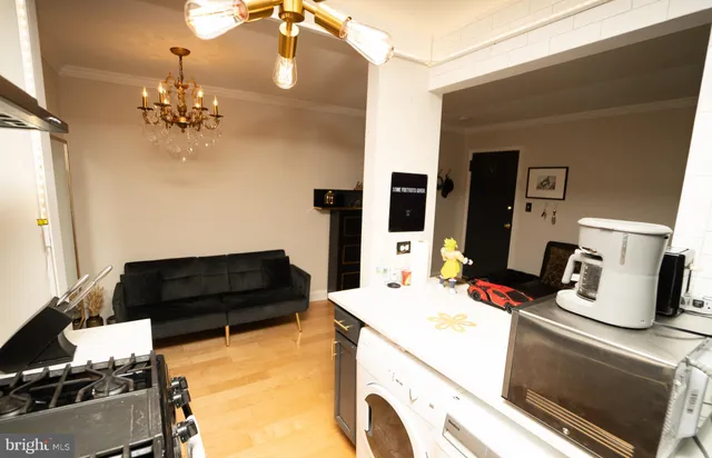 a kitchen with a refrigerator and a stove