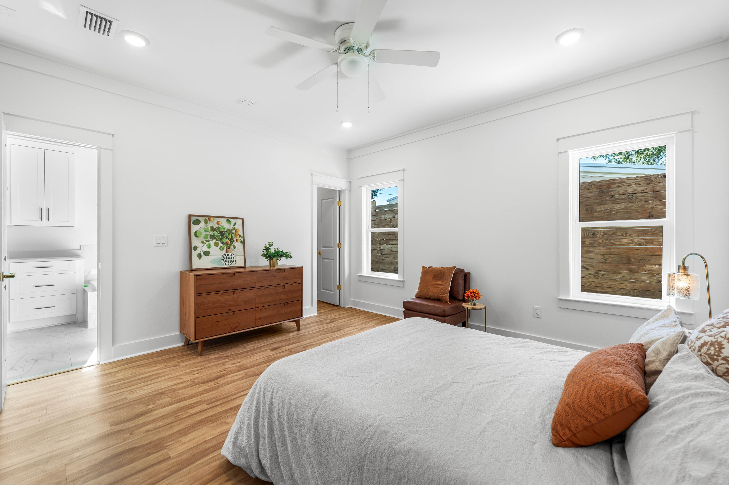 103 Fletcher Way Destin, FL 32541 - Photo 17 of 30 a bedroom with a bed and wooden floor