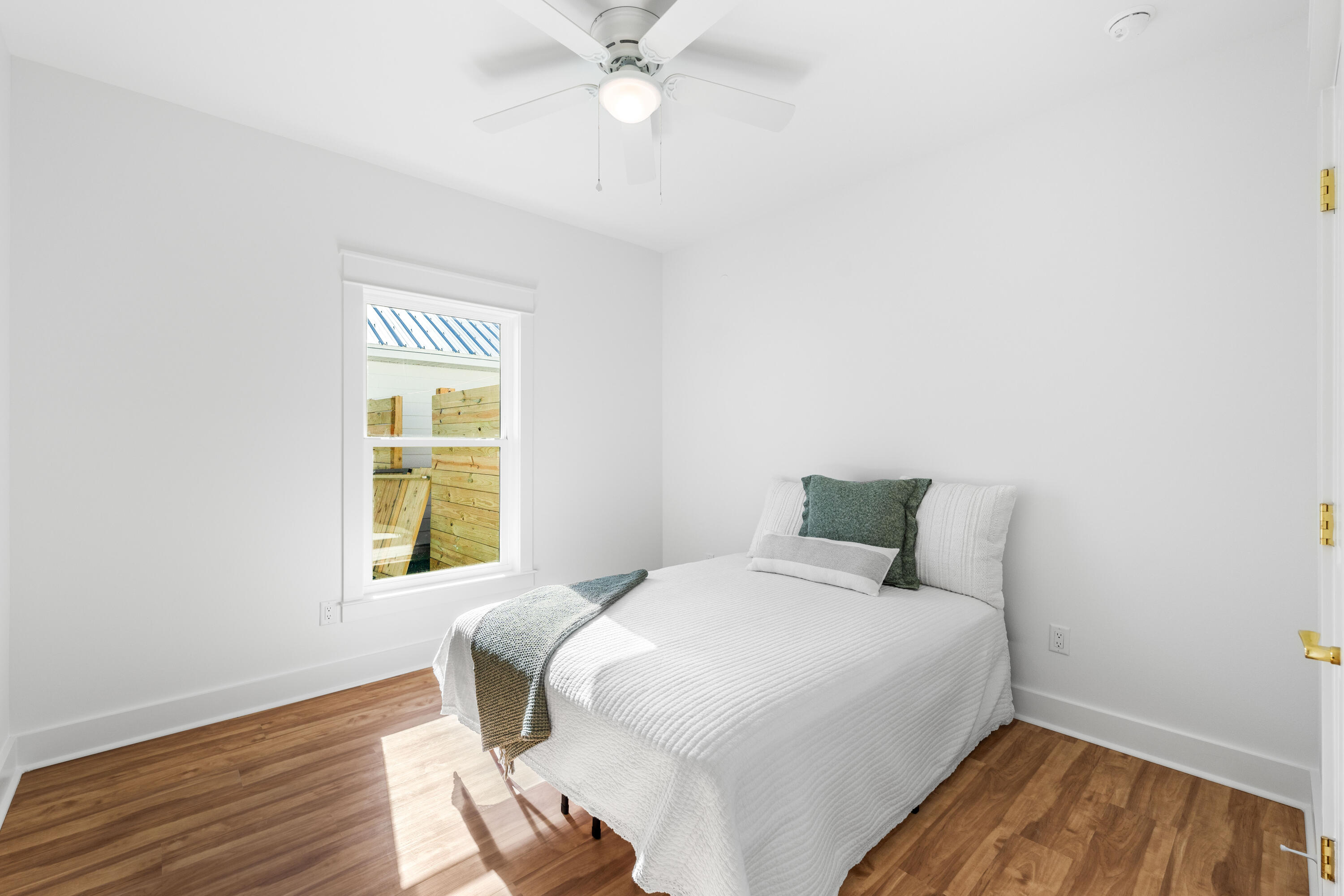 103 Fletcher Way Destin, FL 32541 - Photo 29 of 30 a bedroom with a bed and a window