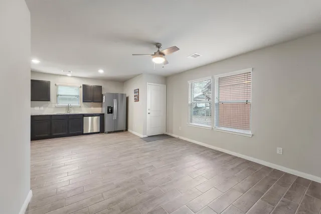 a view of kitchen with wooden floor and window