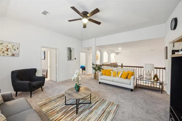 a living room with furniture and a rug