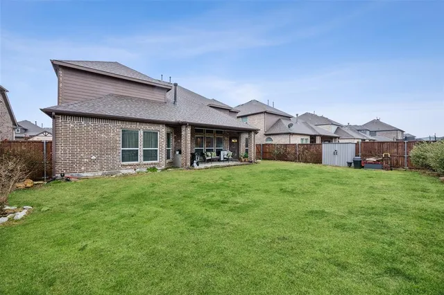 a living room with furniture ceiling fan and a rug