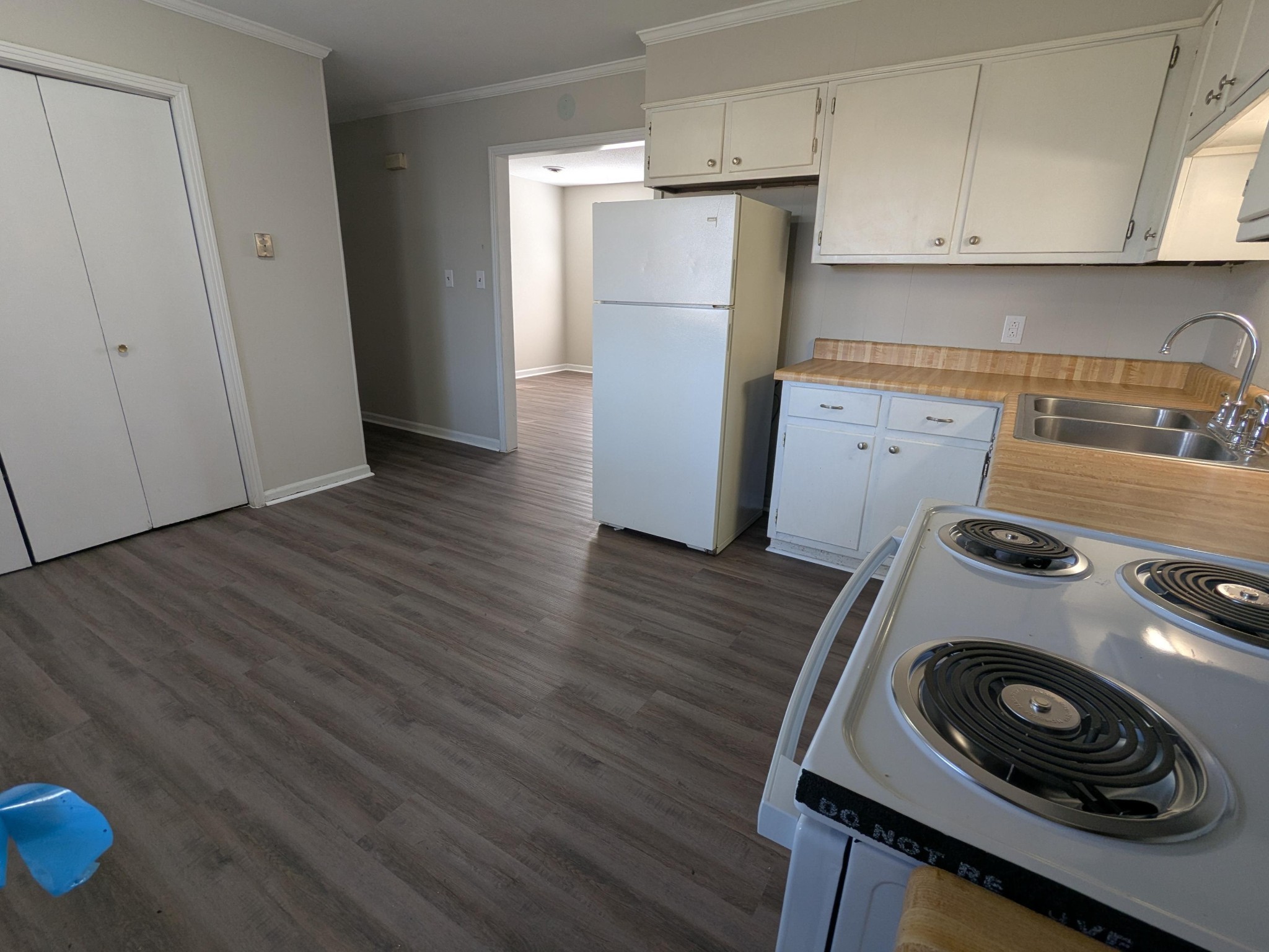 413 Shawnee Drive Columbia, TN 38401 - Photo 4 of 11 a kitchen with a refrigerator a stove and wooden floor