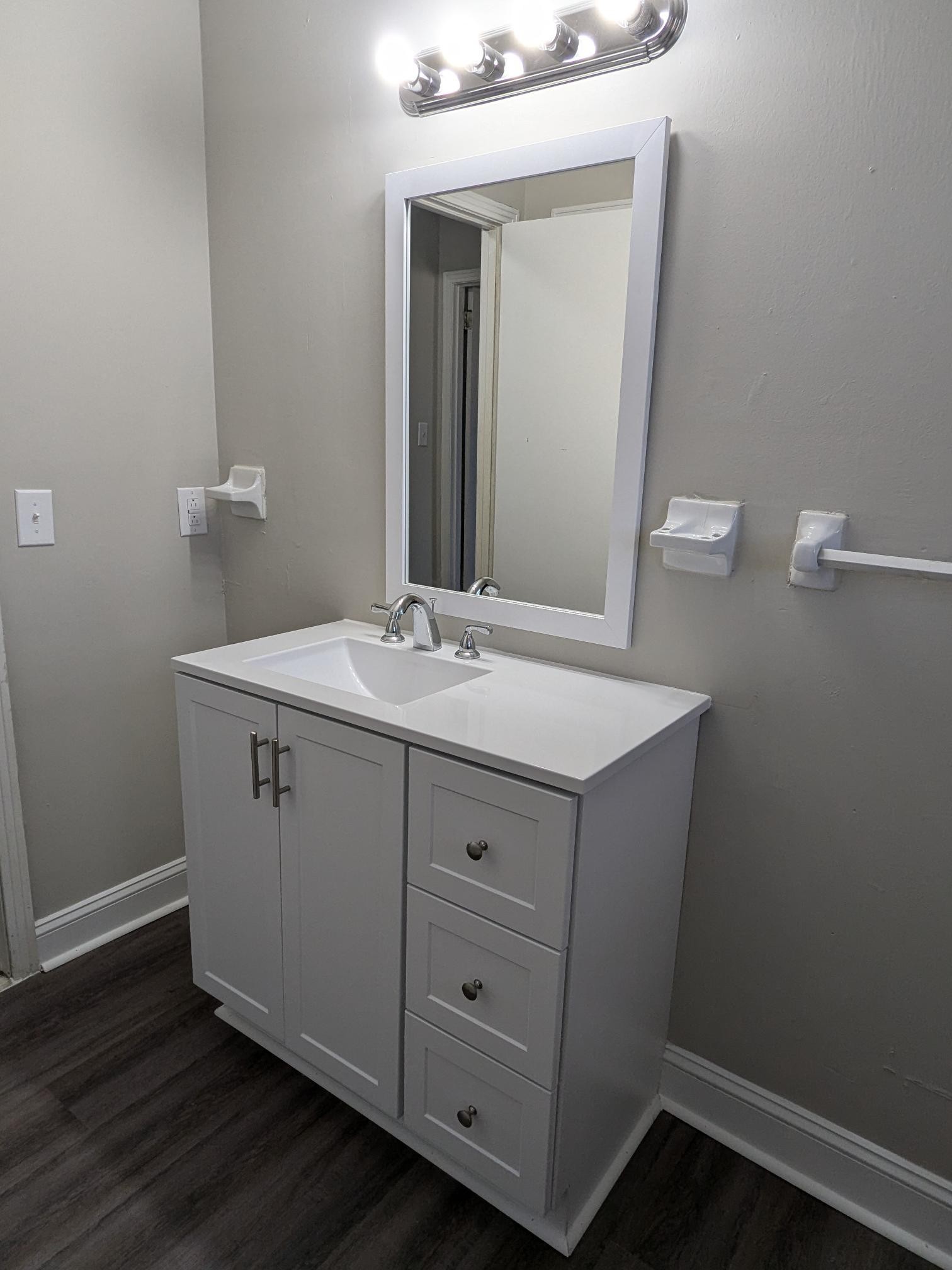 413 Shawnee Drive Columbia, TN 38401 - Photo 8 of 11 a bathroom with a sink vanity and mirror