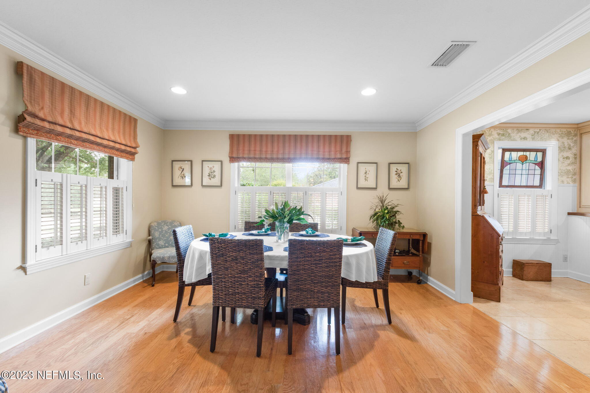 9465 Kells Road Jacksonville, FL 32257 - Photo 29 of 63 a view of a dining room with furniture window and wooden floor