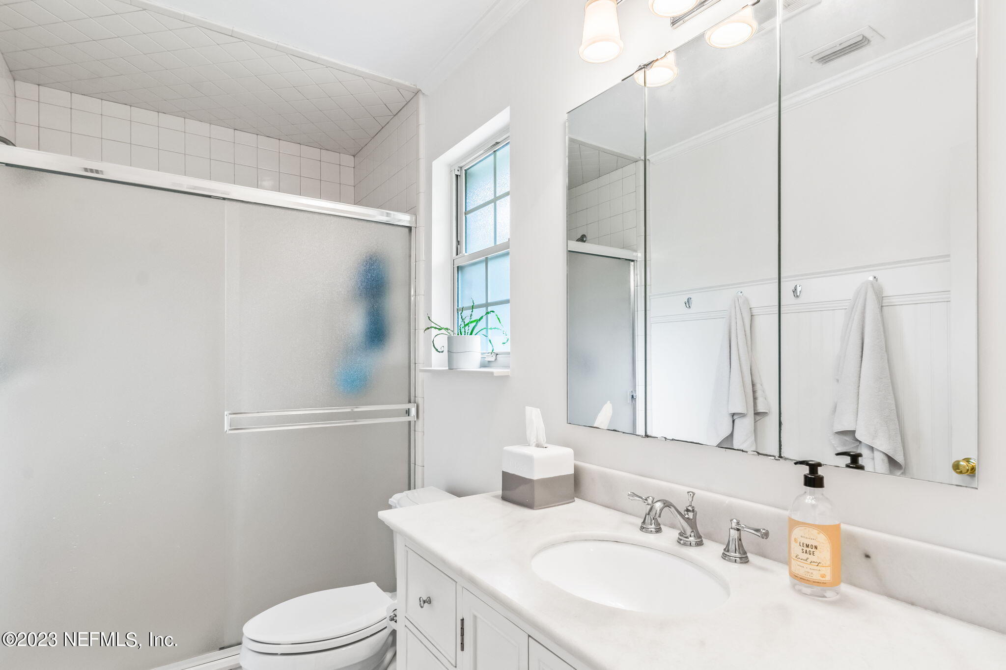9465 Kells Road Jacksonville, FL 32257 - Photo 34 of 63 a bathroom with a sink toilet and shower