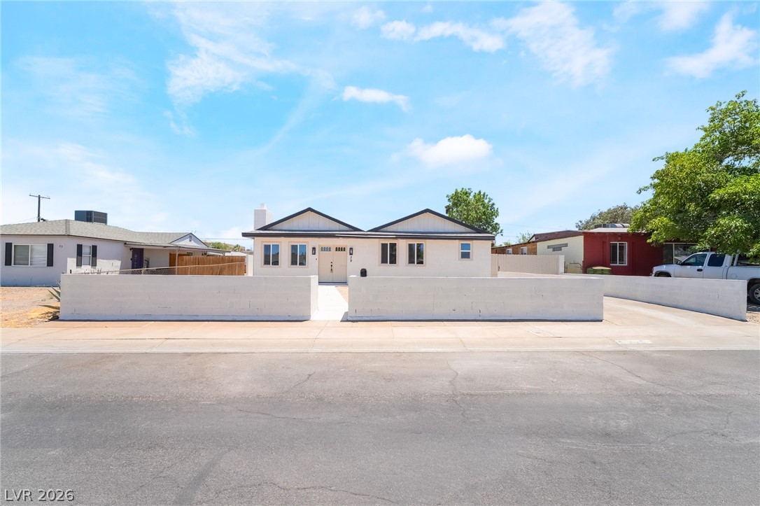 39 Lowery Street Henderson, NV 89015 - Photo 2 of 40 A striking facade with prominent gables and crisp white walls welcomes you home.