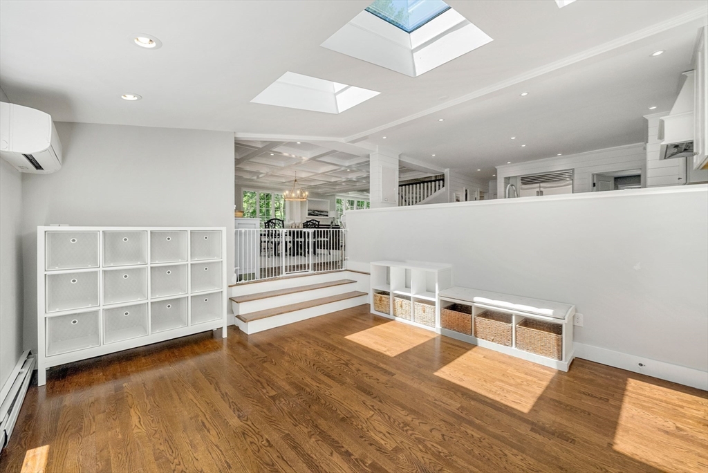 53 Windsor Road Wellesley, MA 02481 - Photo 17 of 42 an empty room with wooden floor and windows