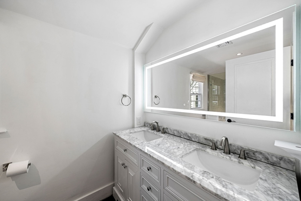 53 Windsor Road Wellesley, MA 02481 - Photo 25 of 42 a bathroom with a granite countertop sink and a mirror