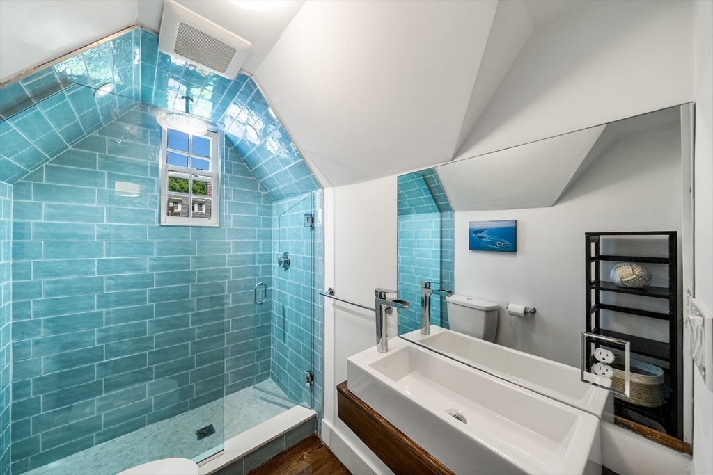 53 Windsor Road Wellesley, MA 02481 - Photo 31 of 42 a bathroom with a bathtub and a shower