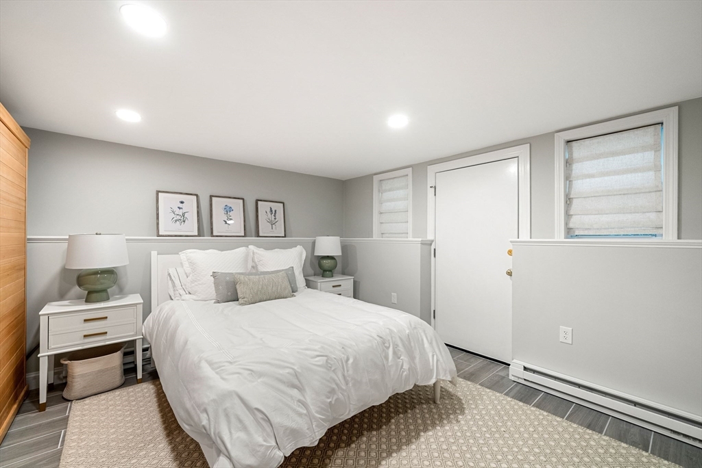 53 Windsor Road Wellesley, MA 02481 - Photo 34 of 42 a bedroom with a bed and a night stand