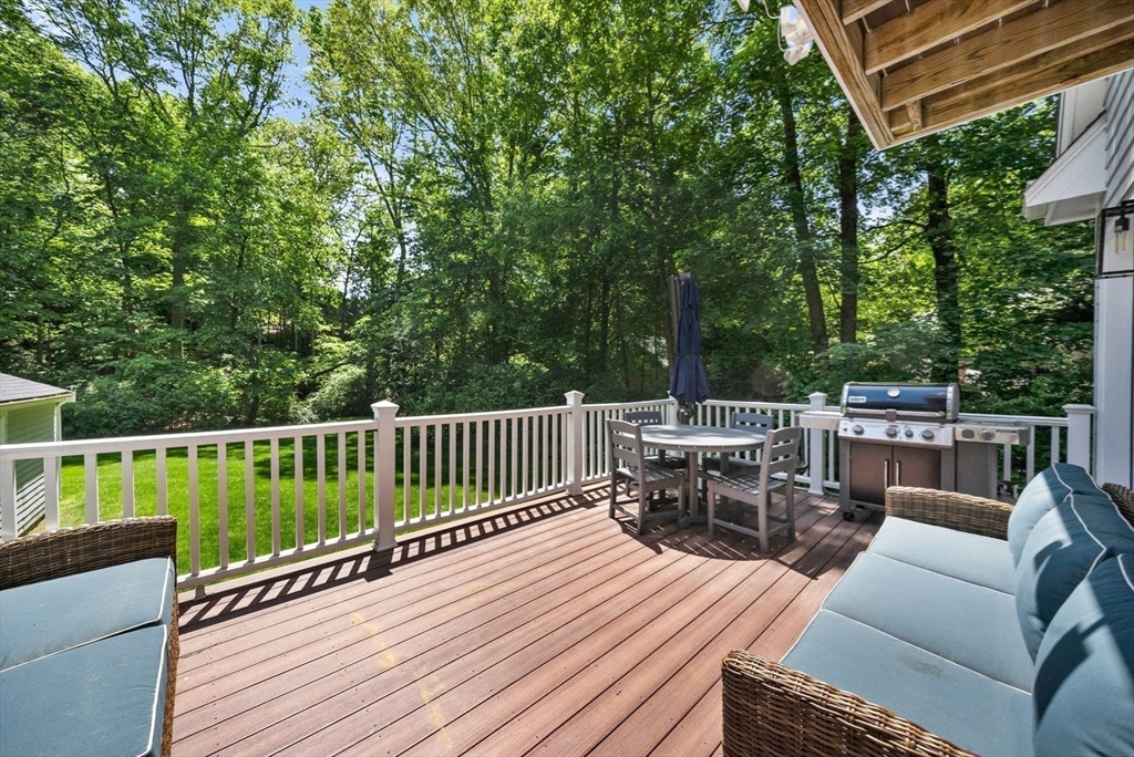 53 Windsor Road Wellesley, MA 02481 - Photo 36 of 42 a view of a patio with two chairs and a table