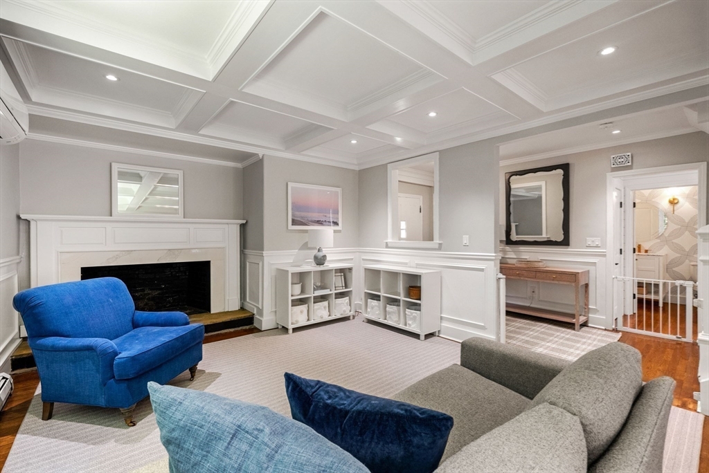 53 Windsor Road Wellesley, MA 02481 - Photo 10 of 42 a living room with furniture flat screen tv and a fireplace
