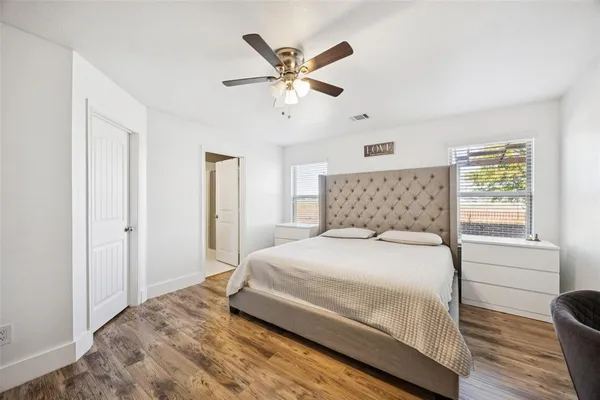 a bedroom with a bed and window