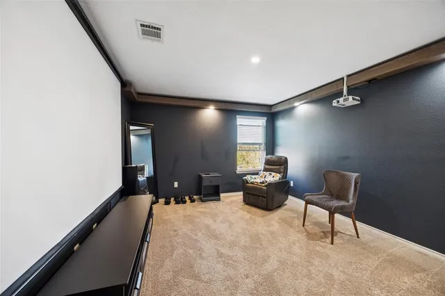 a bedroom with a bed and a chair