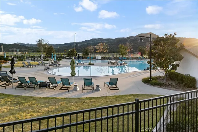 a view of a chairs and table in backyard