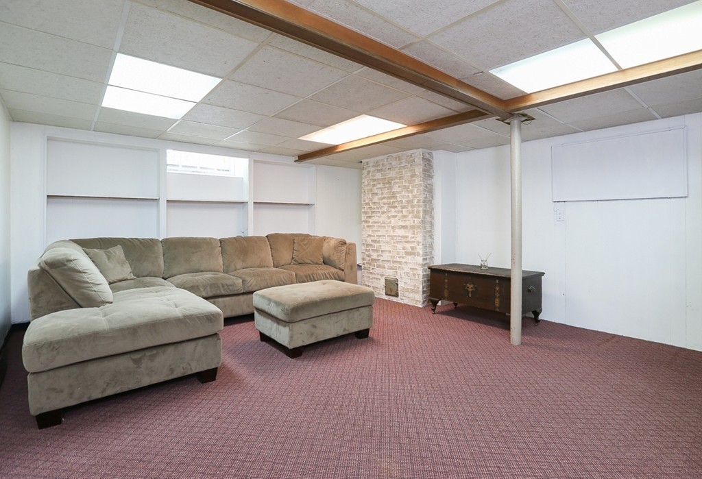 9 Woodside Road Topsfield, MA 01983 - Photo 23 of 27 a living room with furniture and a couch