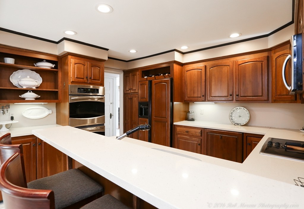 9 Woodside Road Topsfield, MA 01983 - Photo 5 of 27 a kitchen with stainless steel appliances kitchen island granite countertop a sink dishwasher stove and refrigerator with wooden floor