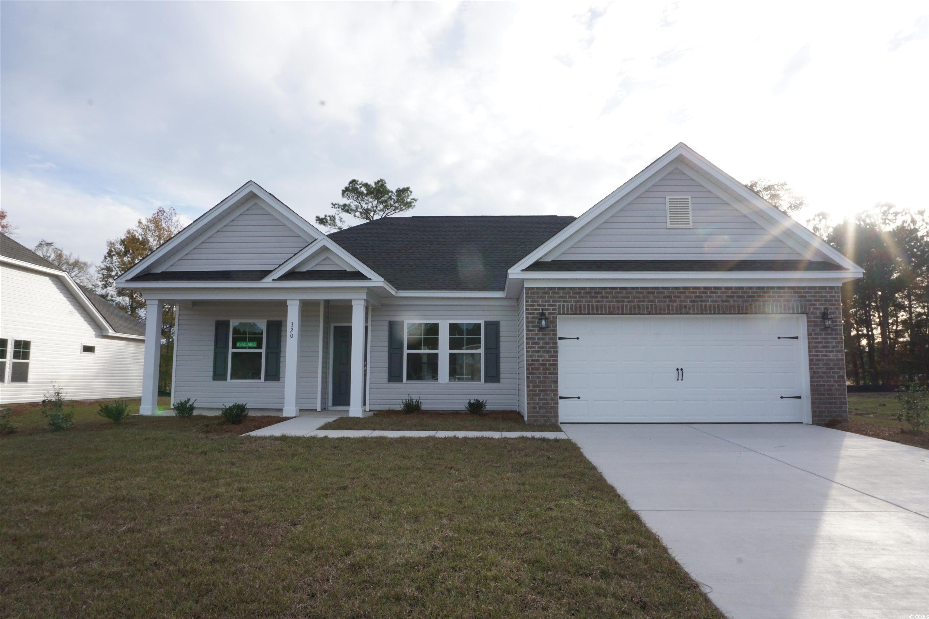 320 Palmetto Sand Loop Conway, SC 29527 - Photo 1 of 38 View of front of property with a porch, a garage,