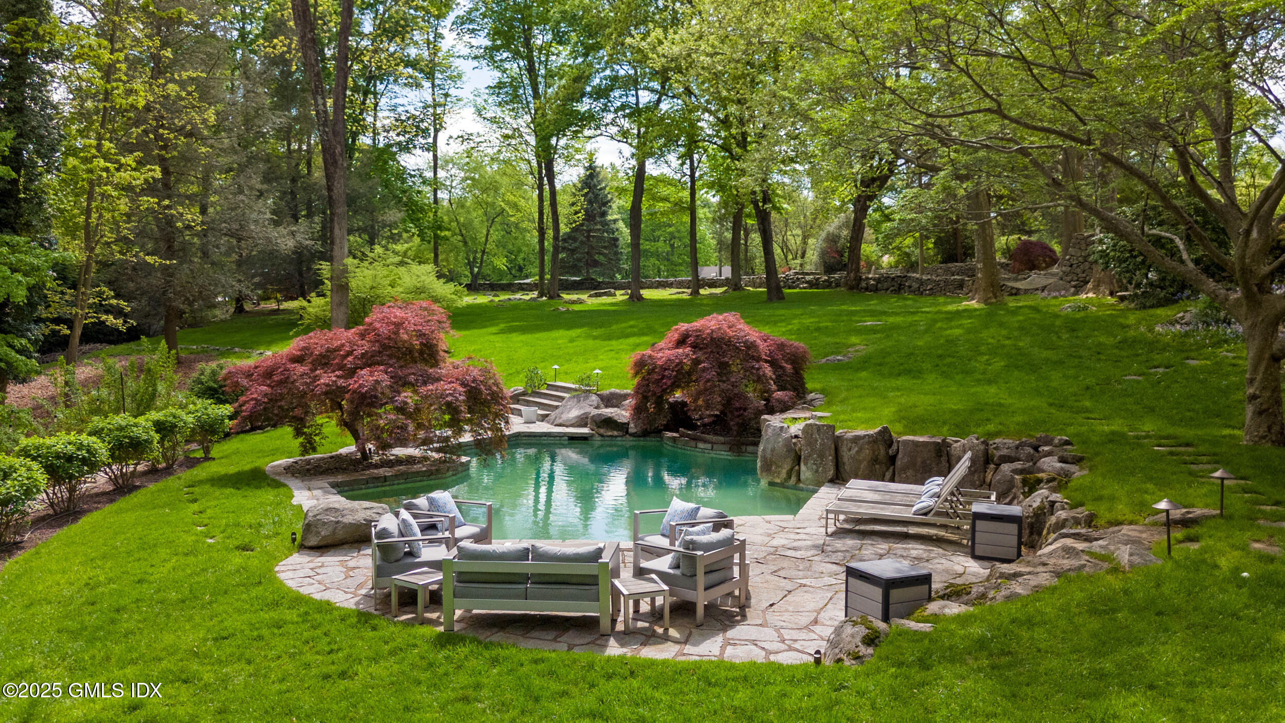 467 Laurel Road New Canaan, CT 06840 - Photo 11 of 50 a view of a table and chairs in the garden