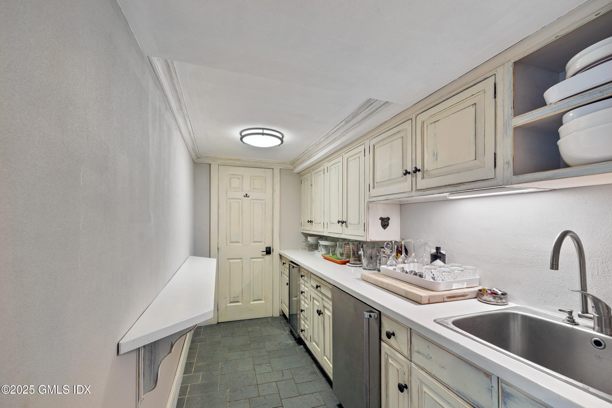 467 Laurel Road New Canaan, CT 06840 - Photo 16 of 50 a kitchen with stainless steel appliances granite countertop a sink and cabinets