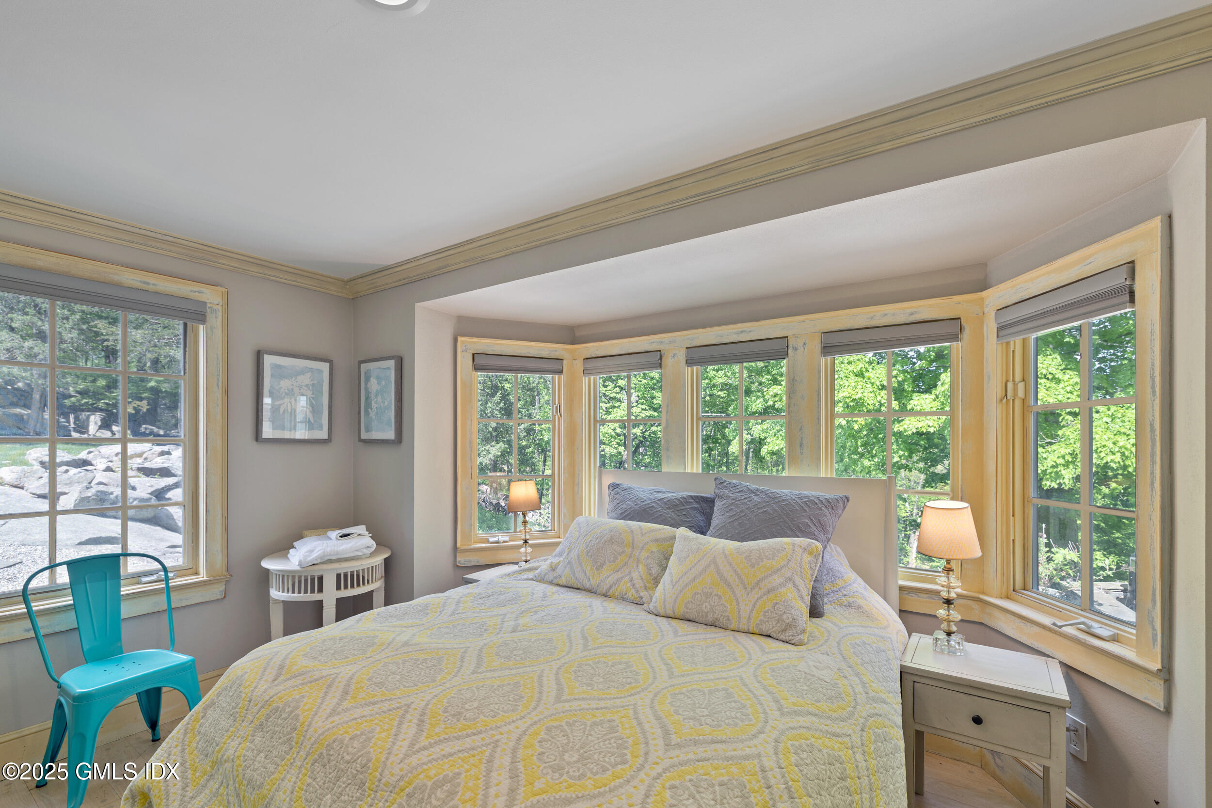 467 Laurel Road New Canaan, CT 06840 - Photo 17 of 50 a bedroom with a large window and a bed